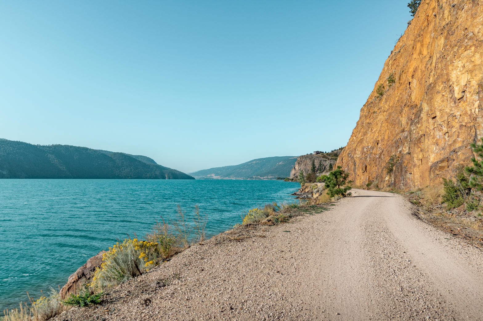 Okanagan Rail Trail along turquoise lake water